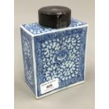 A 19th century Chinese porcelain rectangular tea caddy painted with swirling design,