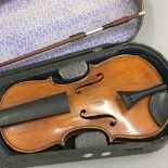 An Antique cased violin and bow
