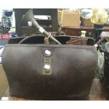 A vintage doctor's Gladstone bag, together with a pair of leather gaiters, swagger stick,