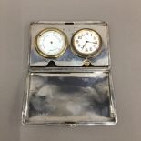 A silver cased travelling clock and barometer