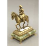 A brass model of Napoleon on an onyx plinth