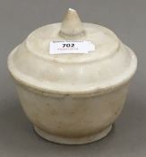 An alabaster pot and cover