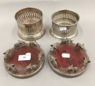 A pair of silver plated bottle coasters with elephant mounts,