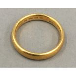 A 22 ct gold wedding band (5 grammes total weight)