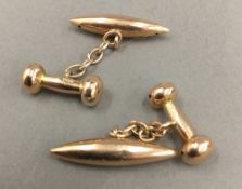 A pair of Edwardian rose gold torpedo and dumbbell cufflink's (4 grammes)