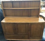 A blonde Ercol dining table,