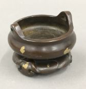 A Chinese bronze gold splash censer on stand