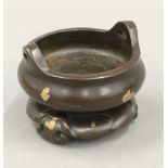 A Chinese bronze gold splash censer on stand