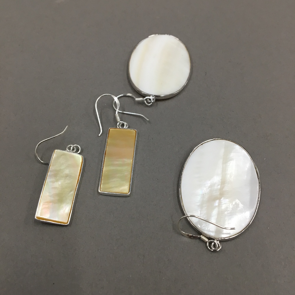 Two pairs of silver shell earrings