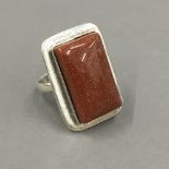 A silver goldstone ring