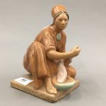 A Russian pottery model of a girl