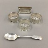 Three silver napkin rings and a silver ''Artist's Rifles'' spoon (109 grammes total weight)