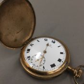 A gold plated Elgin cased Omega full hunter pocket watch