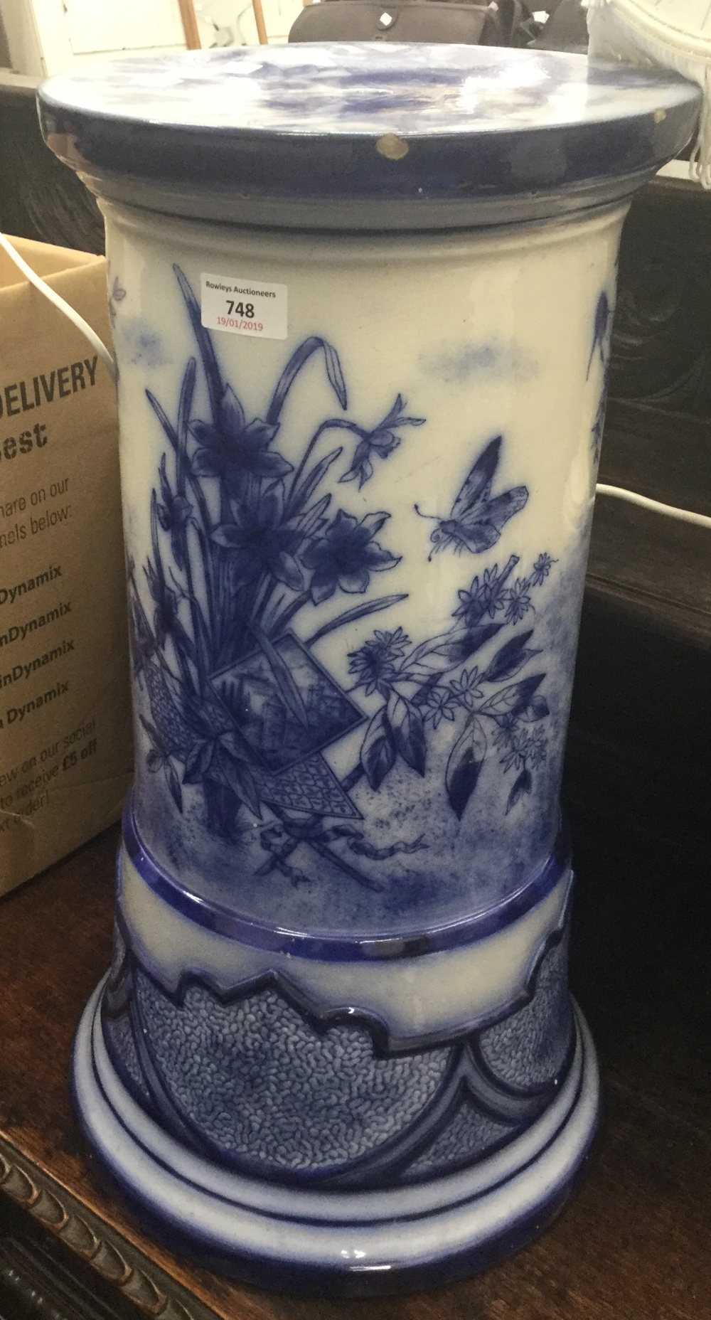 A Victorian blue and white ceramic jardiniere stand