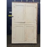 A white painted Victorian pine standing cupboard