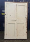 A white painted Victorian pine standing cupboard