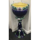 A Majolica jardiniere on stand