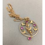 An Edwardian 9 ct gold amethyst set pendant on a 9 ct gold chain (4 grammes total weight)
