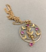 An Edwardian 9 ct gold amethyst set pendant on a 9 ct gold chain (4 grammes total weight)