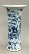 An 18th century Delft blue and white pottery sleeve vase with chinoiserie decoration