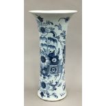 An 18th century Delft blue and white pottery sleeve vase with chinoiserie decoration