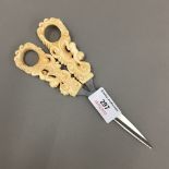 A pair of bone handled scissors