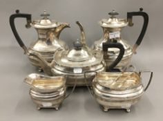 A silver five piece tea set