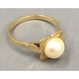 An 18 ct gold pearl set ring,