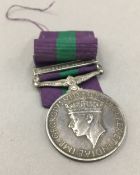 A military service medal with Palestine 1945-48 bar, awarded to 19016608 TPR. H. CHAMP.17/21.