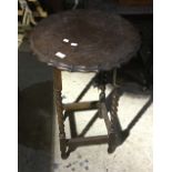 An early 20th century oak barley twist side table