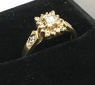 A 9 ct gold diamond set ring