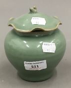 A Chinese celadon jar and cover