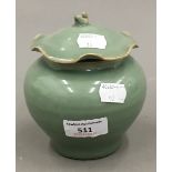 A Chinese celadon jar and cover