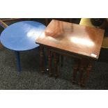 A nest of three table and a blue painted coffee table