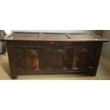 An 18th century carved oak coffer,