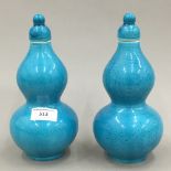 A pair of Chinese turquoise ground double gourd porcelain vases
