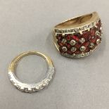 A 10 K gold redstone and diamond ring (9.4 grammes) and a 14 K gold half eternity ring (2.