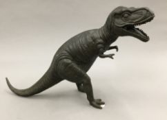 A bronze model of a Tyrannosaurus Rex