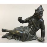 A bronze cast figure, possibly 17th century Worked as a scantily clad reclining figure,