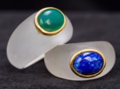 Two unmarked gold mounted frosted glass rings Each cabochon set, one with lapis,