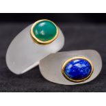 Two unmarked gold mounted frosted glass rings Each cabochon set, one with lapis,