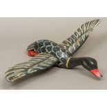 A Folk Art carved and polychrome decorated duck decoy Modelled in flight. 62 cm wing span.