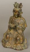 A Chinese cast bronze figure of a court official Modelled seated, with red wax export seal to verso.