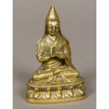 An 18th century or earlier gilt bronze figure of Je Tsongkhapa (1357-1419) Tibetan The Buddhist