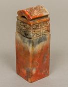 A Chinese carved soapstone seal With domed carved pierced top section,