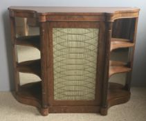 A Regency rosewood side cabinet The shaped top above the brass grille centred cupboard door flanked