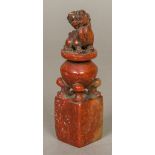 A Chinese carved stone seal Worked with a temple lion, seated upon a censer,