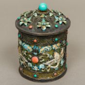 A Chinese silver enamel decorated lidded box The domed removable lid enclosing the jade interior,