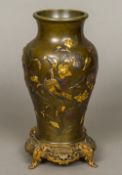 A Japanese Meiji period gilt heightened bronze vase Decorated with a bird amongst scrolling foliage,