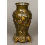 A Japanese Meiji period gilt heightened bronze vase Decorated with a bird amongst scrolling foliage,